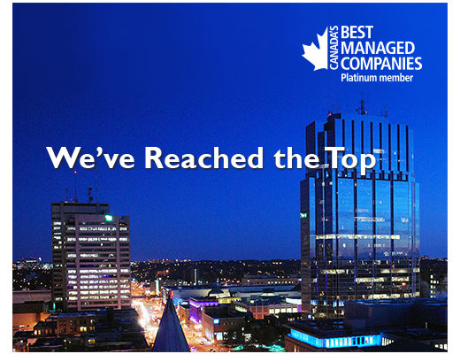 Best managed companies platinum member photo, featuring a city skyline and the tagline 'we've reached the top'