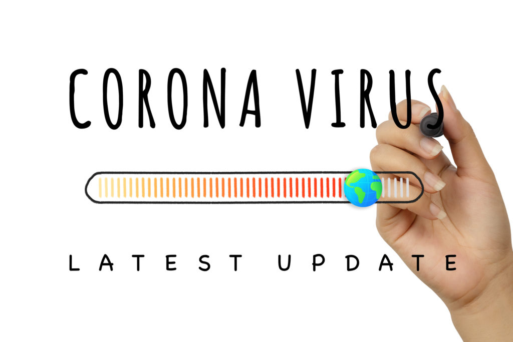 Corona Virus latest update sign written by hand with black marker pen - Covid-19 global epidemic report banner with worldwide country infection progress bar - Pandemic, quarantine and disease concept