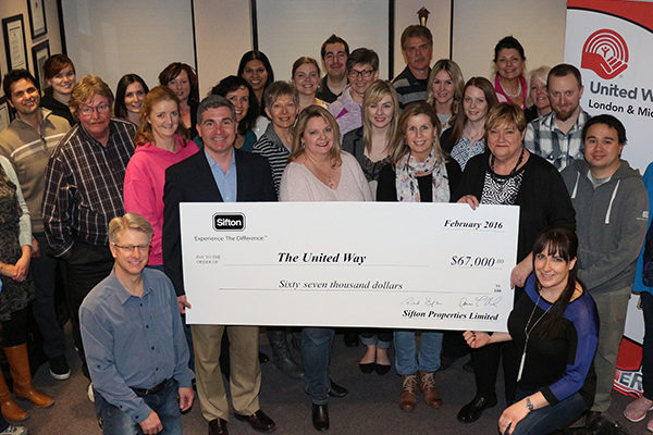 Members of the Sifton team, presenting a cheque for United Way