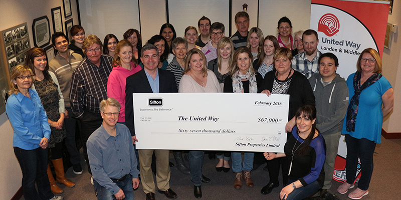 Members of the Sifton team, presenting a cheque for United Way
